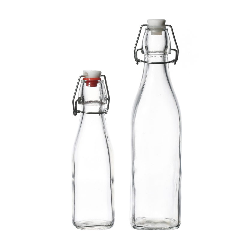 Botellas de vidrio para bebidas al por mayor de 250 ml Botellas de leche de agua con tapas abatibles